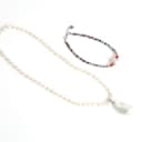 A pearl necklace and gemstone bracelet. (2)