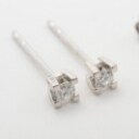 Pair of solitaire diamond earrings, 14 kt. white gold, approx. 0.10 ct