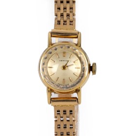 Certina. Vintage women's watch in 18 kt. gold with chain of 14 kt. gold, approx. The 1960s