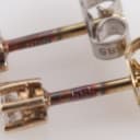 A pair of 14k gold solitaire earrings, 0.20 ct. (2)