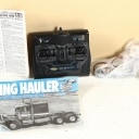 Tamiya. 56336 King Hauler truck, 56302 Semi-Trailer trailer + Carson Reflex Stick 2 remote control, in transport boxes. (2)