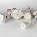 Holmegaard, Bing & Grondahl and others. A collection of porcelain figurines, glass decanters etc. (11)