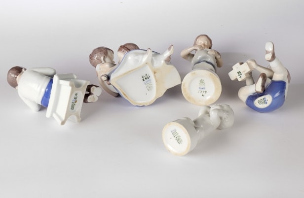Holmegaard, Bing & Grondahl and others. A collection of porcelain figurines, glass decanters etc. (11)