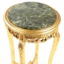 Small round table of gilded wood with a top of green-mottled marble