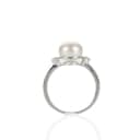 Ring of 9 kt. white gold with freshwater pearl and diamonds, size 55