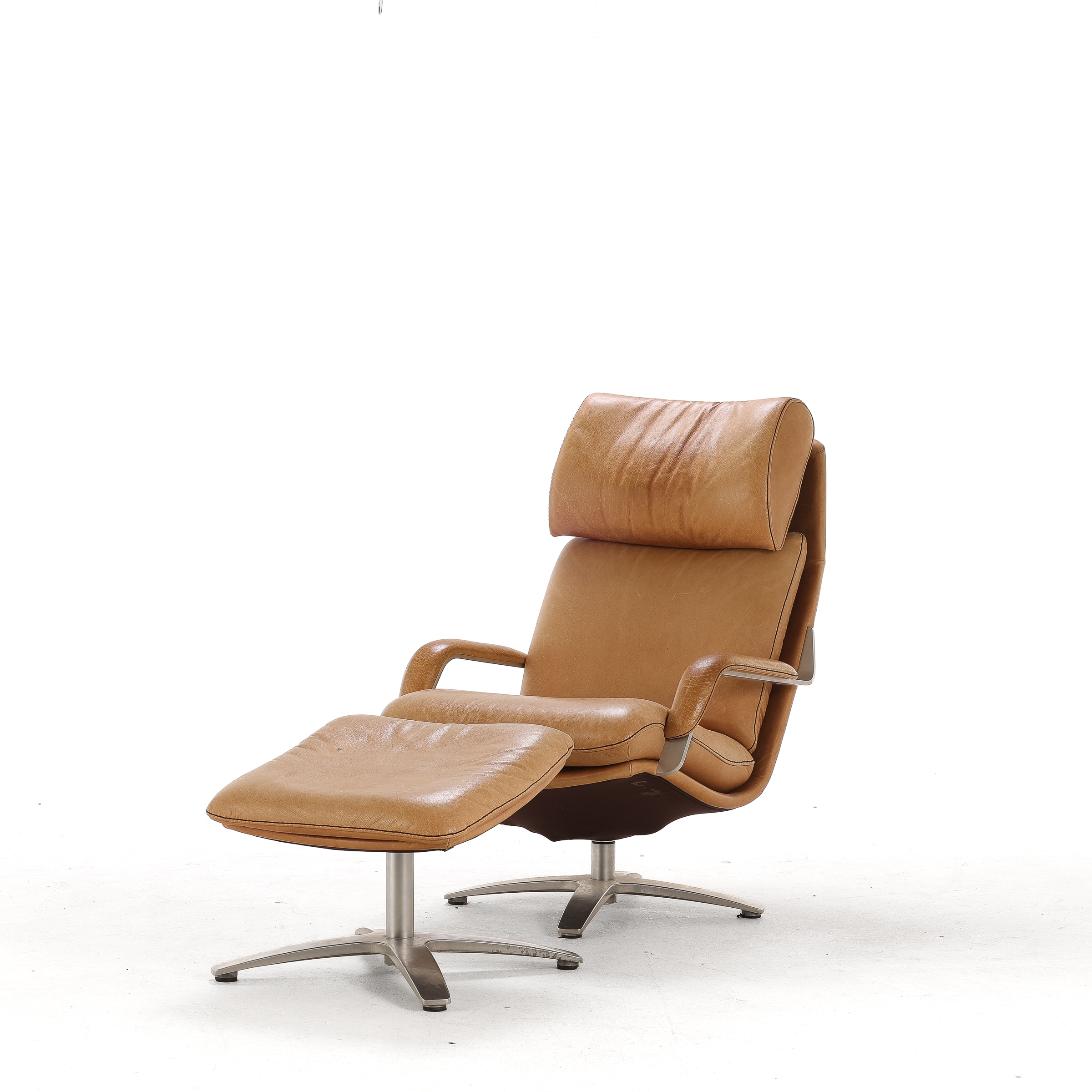 Danish furniture manufacturer circa 2020.: Lounge chair with slightly tilted pouf. (2)