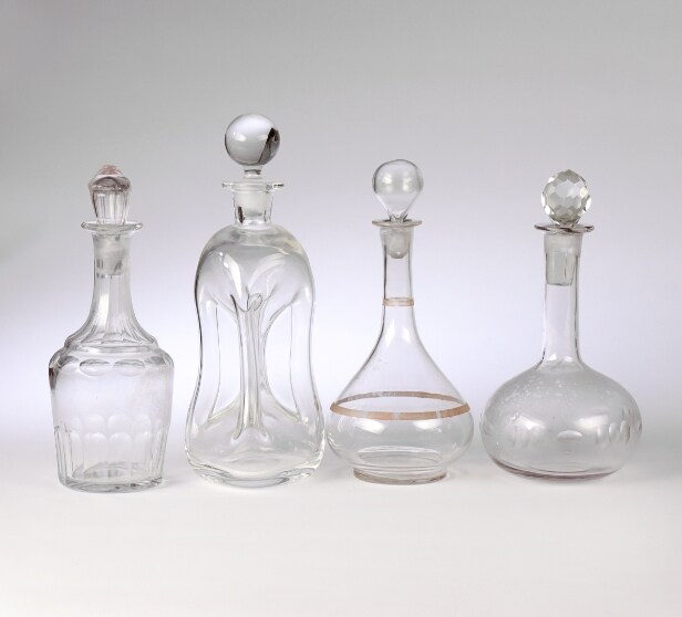 Holmegaard, Bing & Grondahl and others. A collection of porcelain figurines, glass decanters etc. (11)