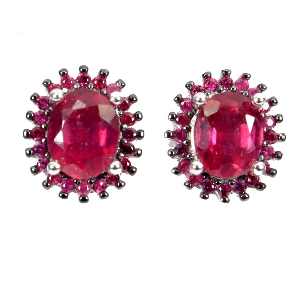Earrings in rhodium-plated sterling silver with black rhodium-plated settings with faceted rubies surrounded by numerous rubies