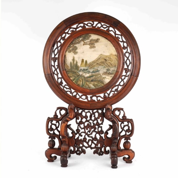 Chinese two-sided porcelain painting mounted in a carved wooden frame on a foot