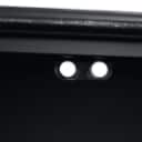 Daneline. Display cabinet in black lacquered metal.
