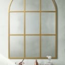 Mirror with curved top, gold-colored iron frame. 125x85 cm