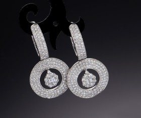 A pair of modern circular brilliant earrings of 18 kt. white gold, total approx. 1.86 ct. (2)