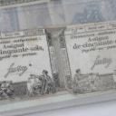 Collection of banknotes in folder, including Russia and France (142)