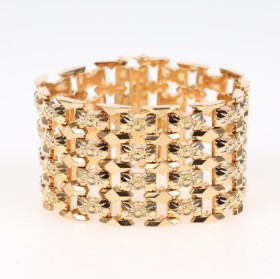 Italian wide bracelet of 18 kt. gold, 73.4 g. The 1960s.