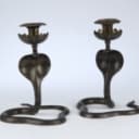 A pair of vintage cobra candlesticks in brass and enamel work (2)