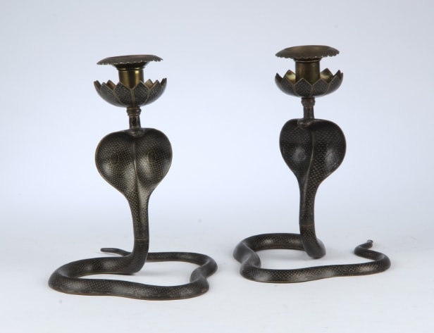 A pair of vintage cobra candlesticks in brass and enamel work (2)