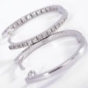 A pair of brilliant-cut diamond hoop earrings in 18 kt. white gold, 0.70 ct. (2)