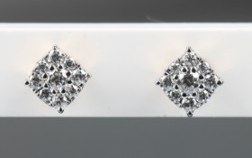 A pair of diamond earrings of 9 kt. rose and white gold, total approx. approx. 0.17 ct. (2)