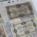 Collection of banknotes in folder, including Russia and France (142)