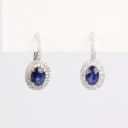 A pair of sapphire and diamond ear pendants of 18k white gold. (2)