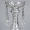 A pair of Empire style candlesticks, a silver candlestick, a glass candlestick (4)
