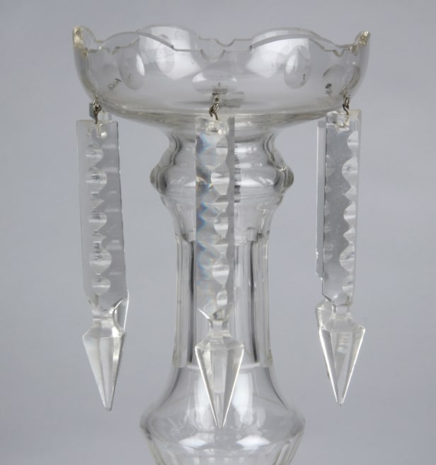 A pair of Empire style candlesticks, a silver candlestick, a glass candlestick (4)