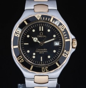 Omega 'Seamaster Pre Bond'. Herreur i 18 kt. guld og stål med sort skive, 1980'erne