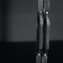 Daneline. Display cabinet in black lacquered metal.