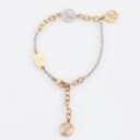 Louis Vuitton. Two-tone metal bracelet with logo pendant