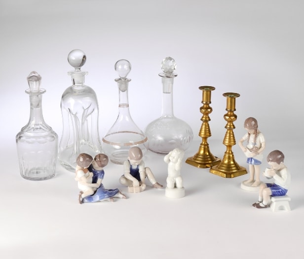 Holmegaard, Bing & Grondahl and others. A collection of porcelain figurines, glass decanters etc. (11)