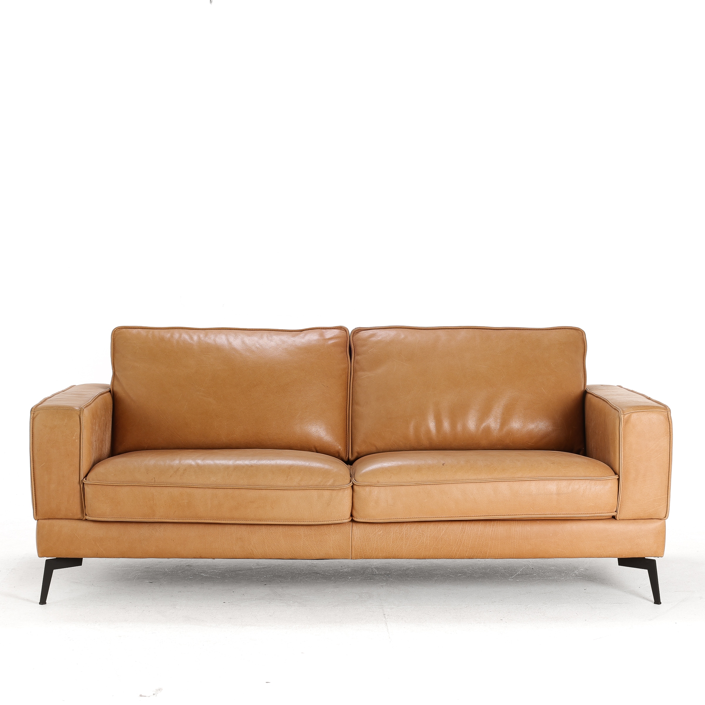 Danish furniture manufacturer circa 2020: Two-seater sofa with patinated leather upholstery.