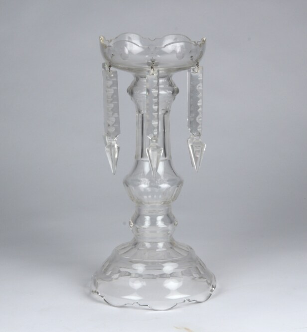 A pair of Empire style candlesticks, a silver candlestick, a glass candlestick (4)