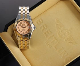 Breitling 'Callistino'. Dameur af 18 kt guld og stål med sart rosa skive, ca. 2000