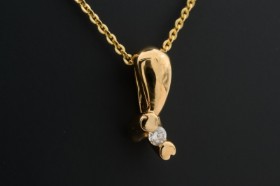 Solitaire pendant with brilliants of 0.05 ct, 14 kt. gold, plus a chain of gilded sterling silver