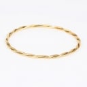 A twisted bangle of 14k gold. Weight 12.5 g.