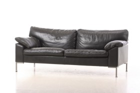 Sofa upholstered in black leather