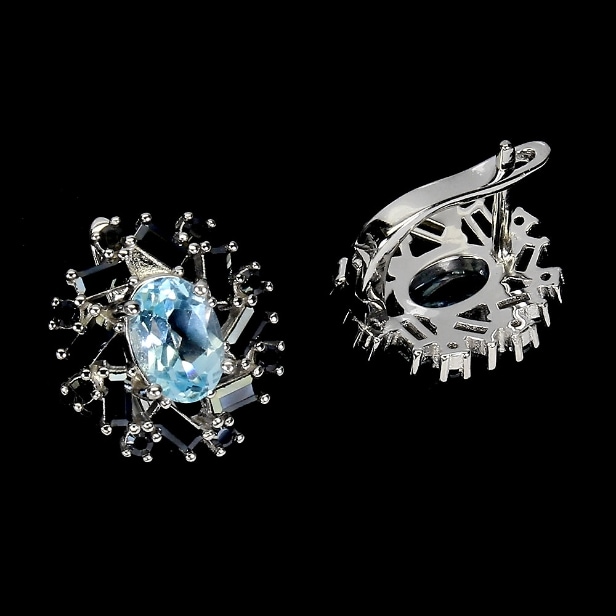 A pair of rhodium-plated sterling silver earrings with faceted topazes and black spinels. (2)
