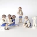 Holmegaard, Bing & Grondahl and others. A collection of porcelain figurines, glass decanters etc. (11)