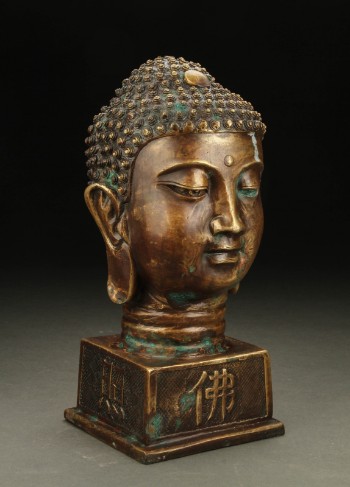 Buddhahoved af patineret metal, 1900-/2000-tallet