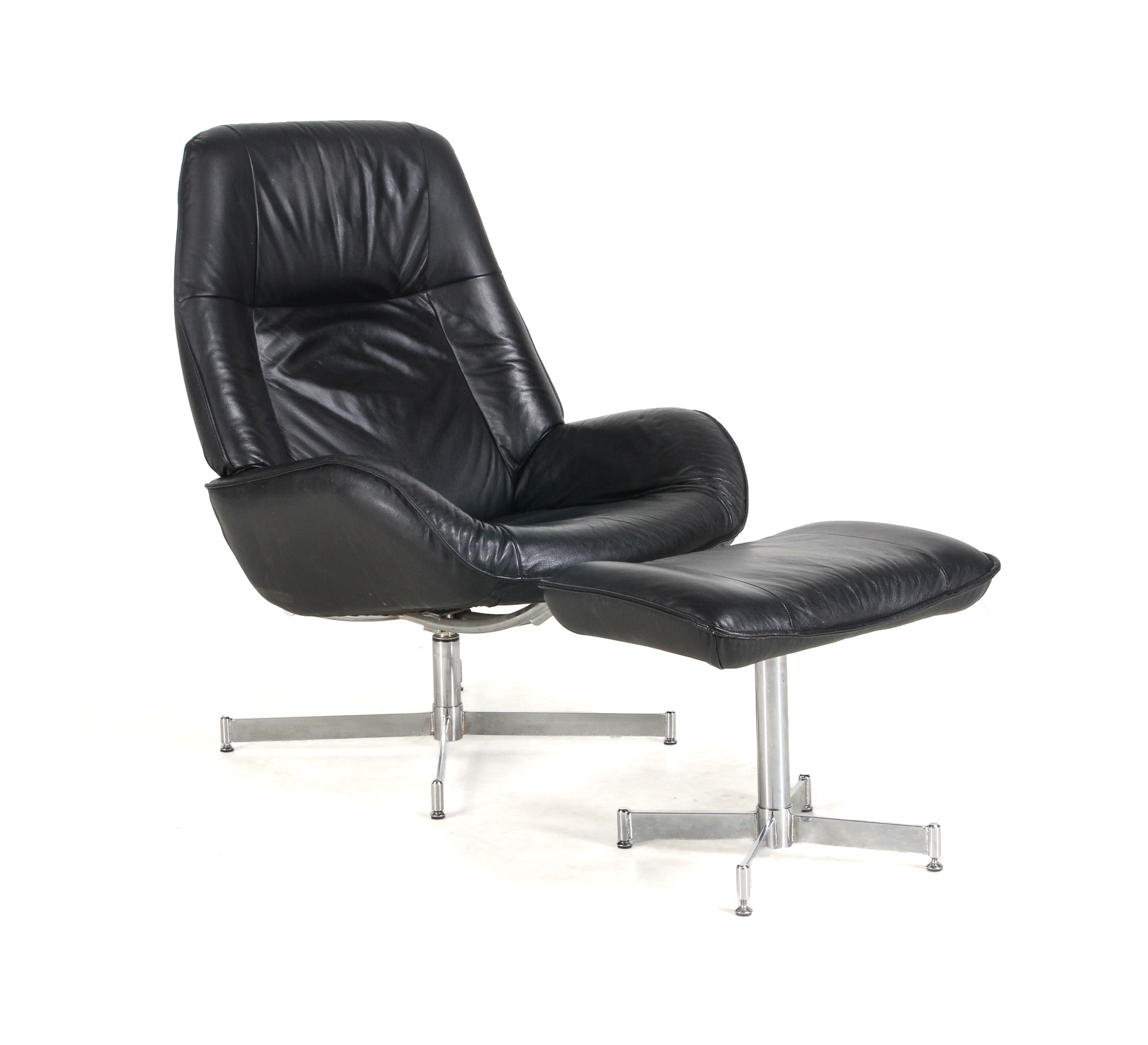 Kebe. ??Armchair and stool, black leather (2)