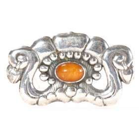 Beautiful silver brooch with amber.