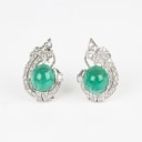A pair of emerald and diamond ear studs of 14k white gold. 1940s. (2)