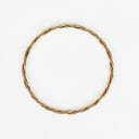 A twisted bangle of 14k gold. Weight 12.5 g.
