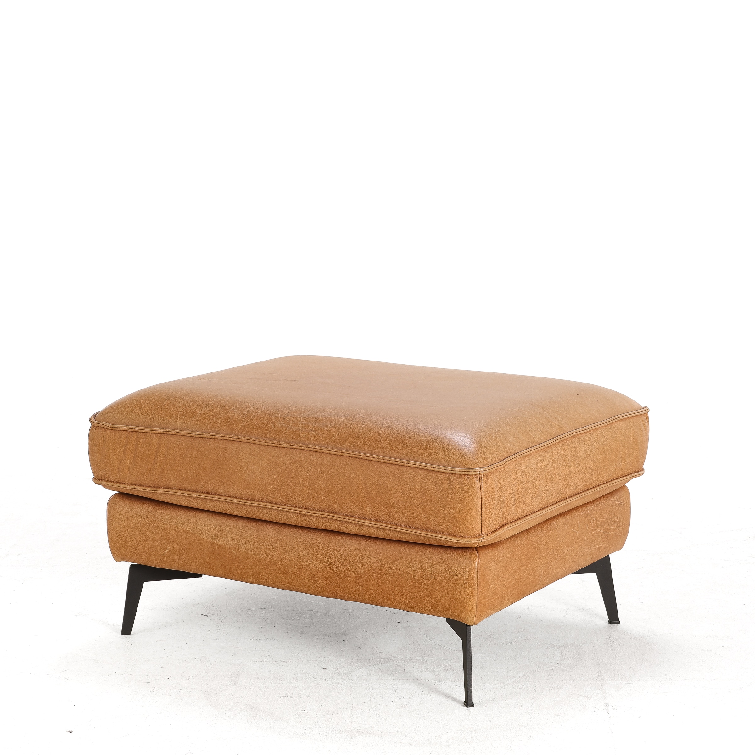 Danish furniture manufacturer circa 2020: Rectangular pouf made of light patinated leather.