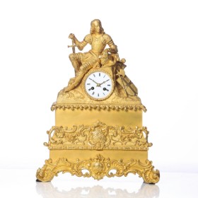 Rococo mantel clock of gilded bronze