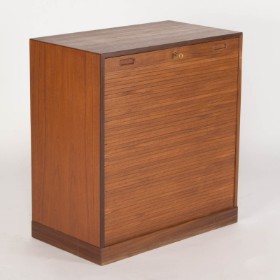 Danish furniture manufacturer. Low teak cabinet with shutter door.