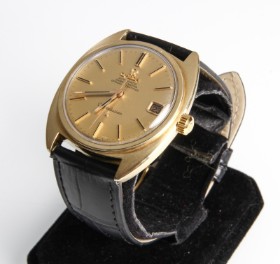 Omega Constellation automatic men's wristwatch in steel with gold casing.