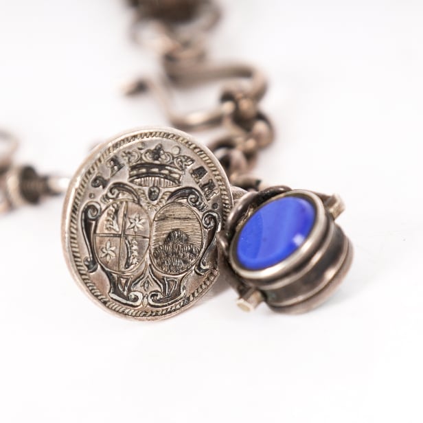 Three signets: One in a silver chain, a three-sided one with von Benzon ...