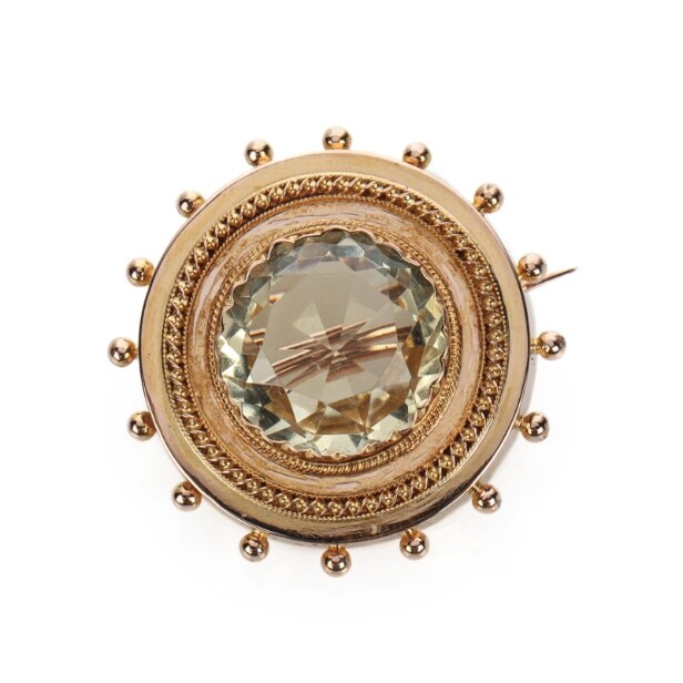 Vintage brooch of 14 kt red gold with citrine