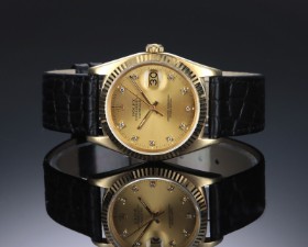 Rolex 'Datejust'. Herreur i 18 kt. guld med brillantbesat skive, ca. 1987